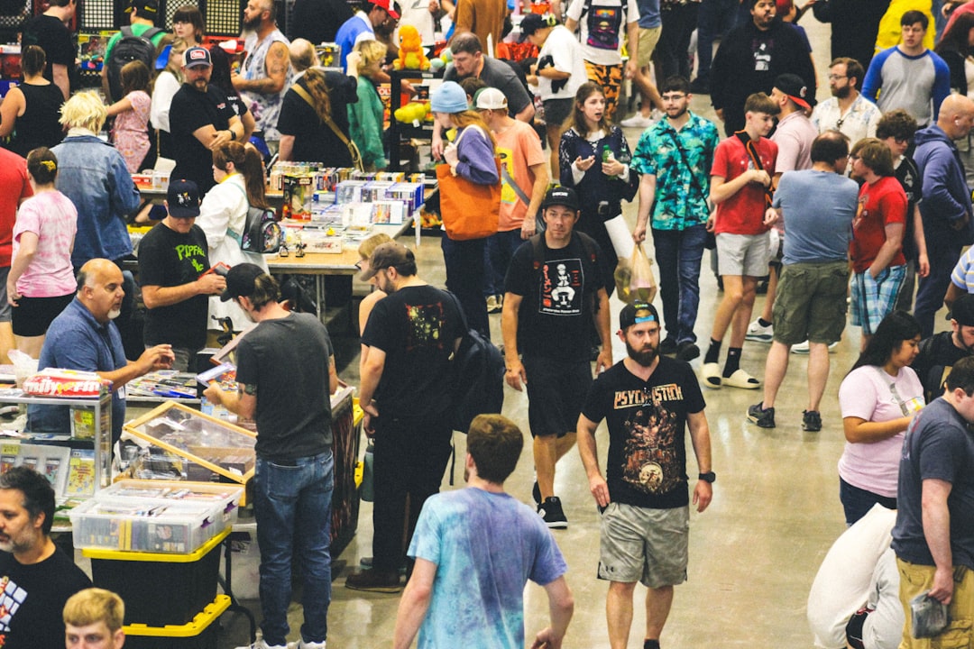 Convention center aisle crowded with exhibition attendees